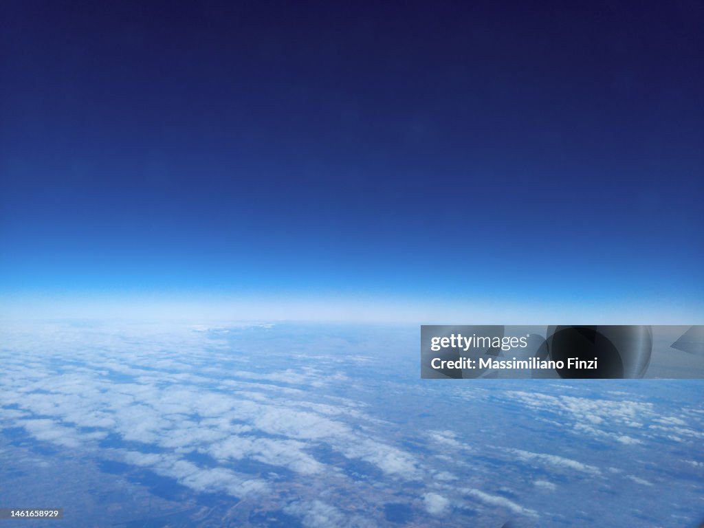 High angle view of the earth with the dark sky, the clouds