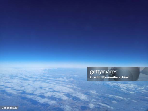 high angle view of the earth with the dark sky, the clouds - stratosphere stock pictures, royalty-free photos & images