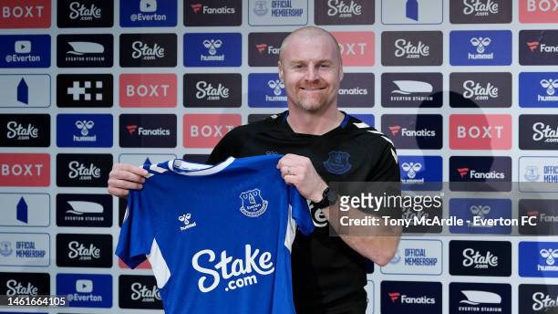 Sean Dyche holds up an Everton shirt before he speaks to the media during the Everton Press Conference at Finch Farm on February 02, 2023 in...