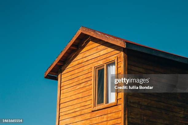 wooden small house over blue sky - wooden fence bildbanksfoton och bilder