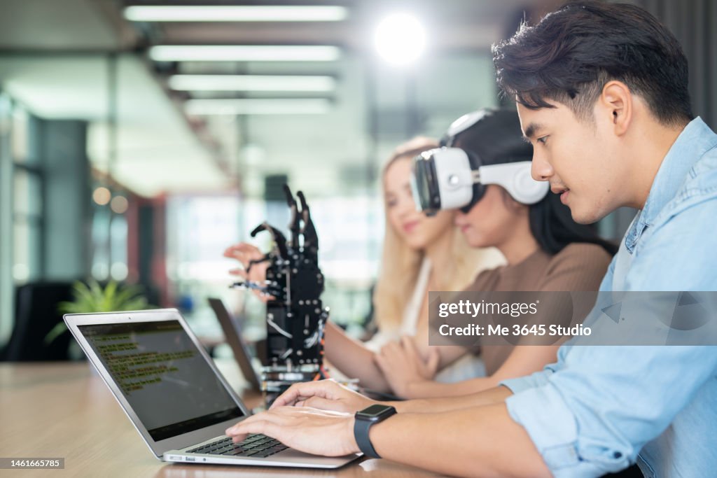 Women and men learn computer robot innovations.
