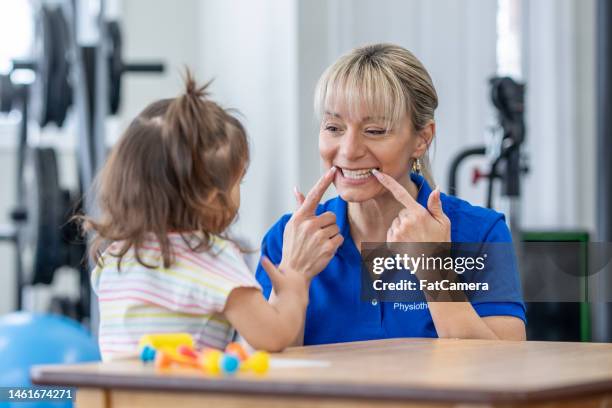 speech therapy - speech pathology stock pictures, royalty-free photos & images