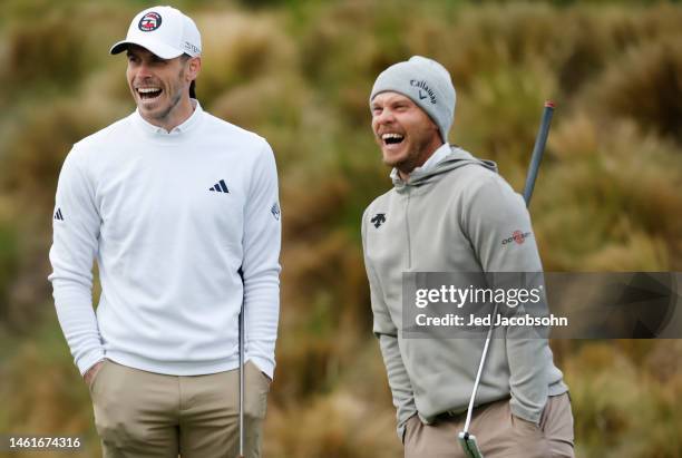 Gareth Bale and Danny Willett of England warm up on the putting green during the first round of the AT&T Pebble Beach Pro-Am at Spyglass Hill Golf...