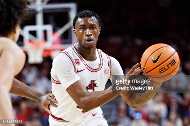 Davonte Davis of the Arkansas Razorbacks runs the offense during a game against the Texas A&M Aggies at Bud Walton Arena on January 31, 2023 in...