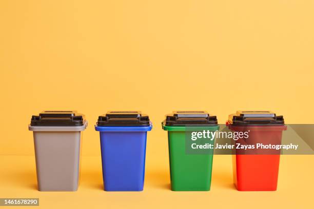 different color recycling garbage container - mixed recycling bin stock pictures, royalty-free photos & images