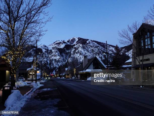 ketchum, idaho pre dawn street view with sun valley ski resort beyond. - ketchum idaho stock pictures, royalty-free photos & images