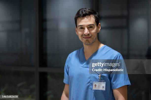 portrait of a male nurse working at the hospital - resident stock pictures, royalty-free photos & images