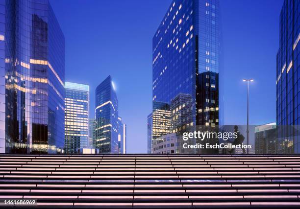 businessman arriving at modern business district at dawn - tracking progress stock pictures, royalty-free photos & images