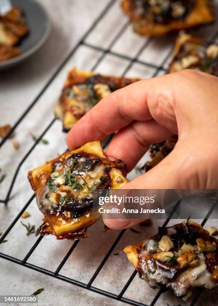 mini caramelised onion tarts - puff pastry stock pictures, royalty-free photos & images
