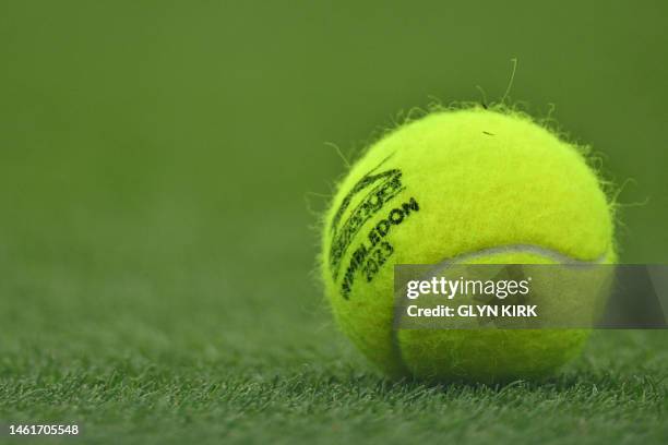 Tennis ball is pictured on the lawn on the first day of the 2023 Wimbledon Championships at The All England Tennis Club in Wimbledon, southwest...