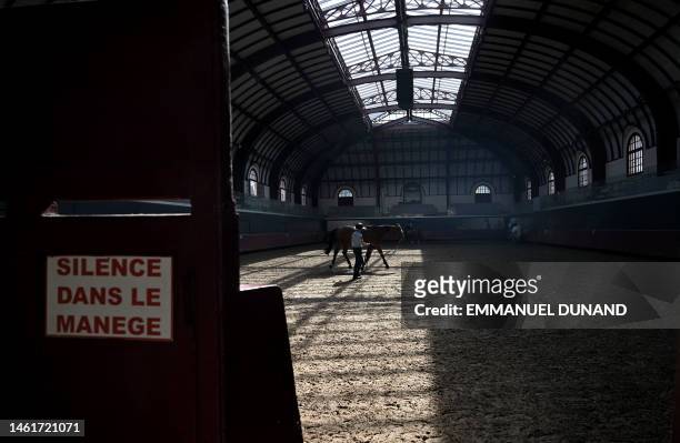 Gendarme of French Republican Guard trains a horse, at the Celestin barracks in the heart of Paris on May 4, 2023.