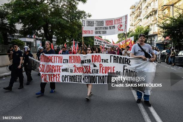 Demonstrators hold banners and shout slogans outside the Institute and Consulate of France, in Thessaloniki on July 3 during a protest after a...