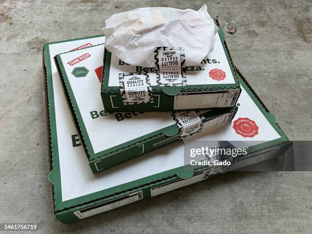 Papa John's pizza and food delivery on a concrete surface, Lafayette, California, December 14, 2022. Photo courtesy Sftm.