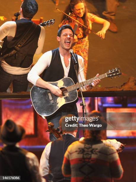 Steve Kazee performs on stage with the case of 'Once the Musical' onstage at the 66th Annual Tony Awards at The Beacon Theatre on June 10, 2012 in...
