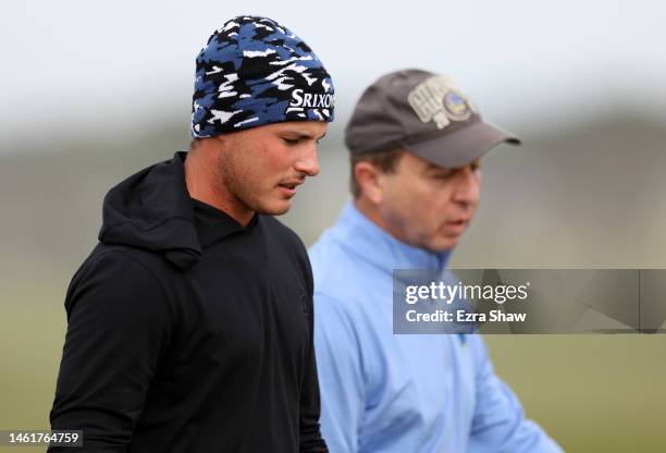 Brent Grant and Joe Lacob walk on the 16th tee during the first round of the AT&T Pebble Beach Pro-Am at Monterey Peninsula Country Club on February...