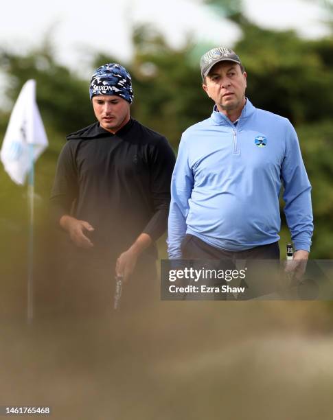 Brent Grant of the United States and Joe Lacob wait to putt on the 15th green during the first round of the AT&T Pebble Beach Pro-Am at Monterey...