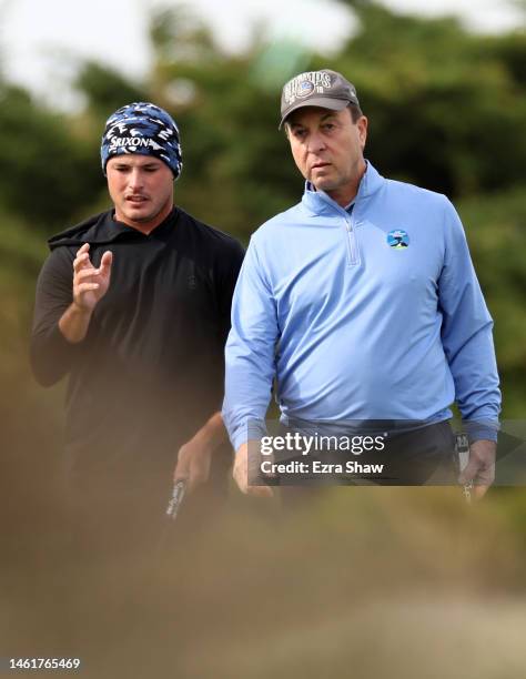 Brent Grant of the United States and Joe Lacob wait to putt on the 15th green during the first round of the AT&T Pebble Beach Pro-Am at Monterey...