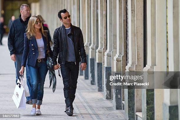 Actress Jennifer Aniston and boyfriend Justin Theroux are seen at the 'Palais Royal' gardens on June 11, 2012 in Paris, France.