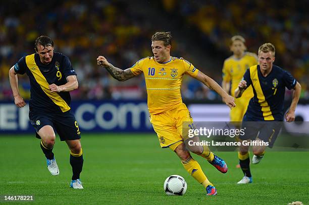 Kim Kallstrom of Sweden chases down Andriy Voronin of Ukraine during the UEFA EURO 2012 group D match between Ukraine and Sweden at The Olympic...