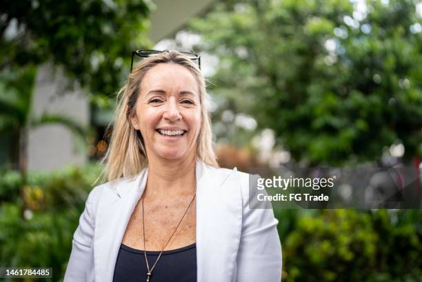 portrait of a businesswoman outdoors - only mature women stock pictures, royalty-free photos & images