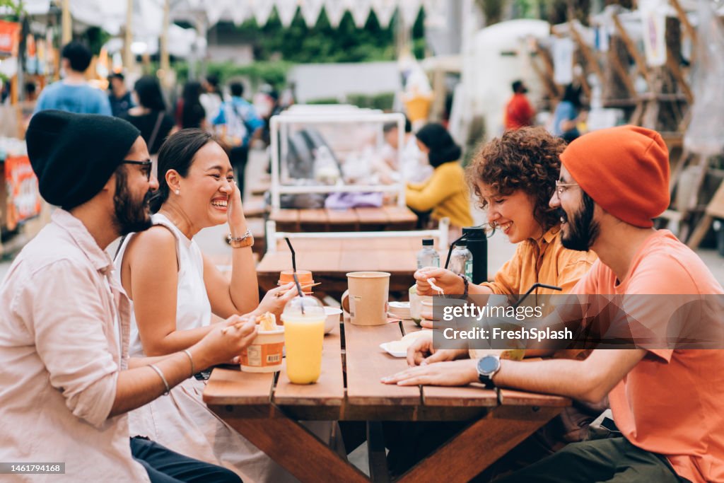 A Group Of Happy Friends Spending Their Leisure Time Together Outdoors