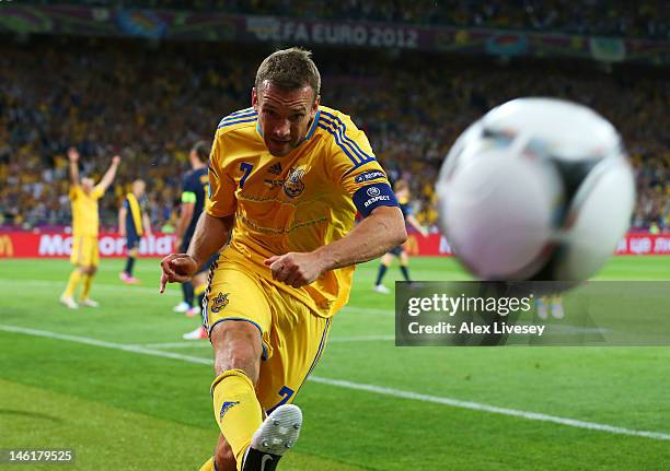 Andriy Shevchenko of Ukraine celebrates scoring their second goal by kicking the ball during the UEFA EURO 2012 group D match between Ukraine and...