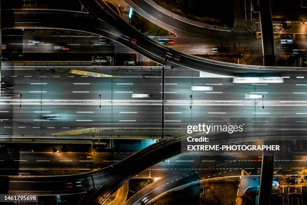 highway seen by night high up in belgrade and captured with a drone - helicopter night stock pictures, royalty-free photos & images