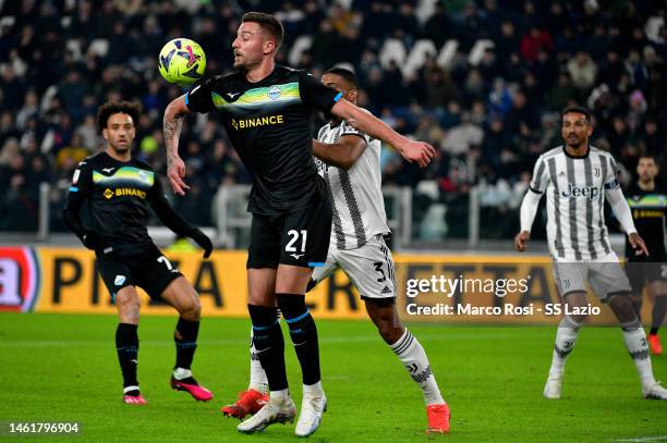 Sergej Milinkovic Savic of SS Lazio compete for the ball with Bremer of Juventus during the coppa Italia quarter final match between Juventus v SS...