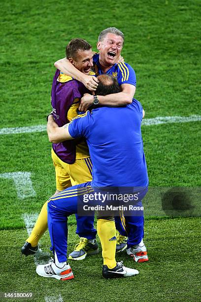 Head Coach Oleh Blokhin of Ukraine celebrates victory Andriy Shevchenko of Ukraine during the UEFA EURO 2012 group D match between Ukraine and Sweden...