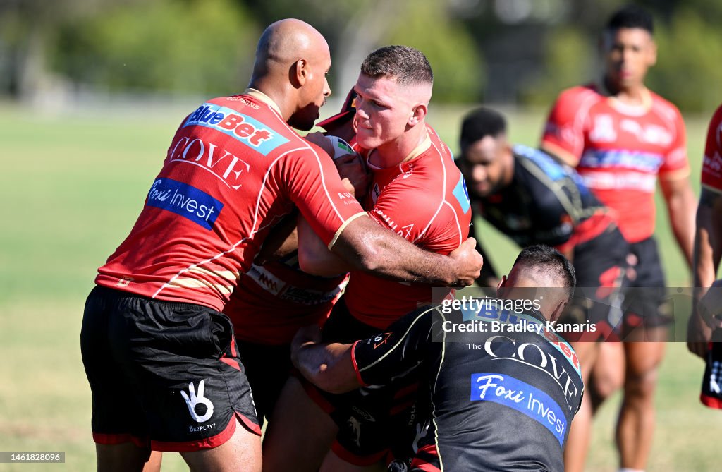 Nrl Ruck Tom Gilbert is wrapped up by the defence during a Dolphins NRL... News ...
