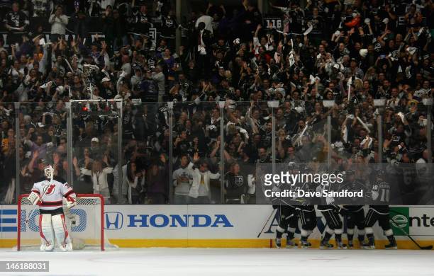 Trevor Lewis of the Los Angeles Kings celebrates his power play goal with teammates making the score 3-0 in the first period of Game Six of the 2012...