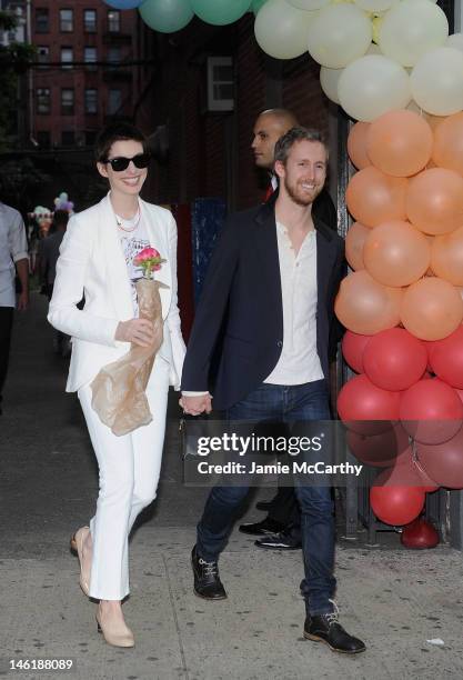 Anne Hathaway and fiance Adam Shulman attend the Stella McCartney Spring 2012 Presentation at Stella McCartney Store on June 11, 2012 in New York...