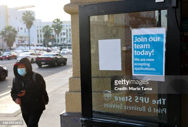 Person walks past a "Join our team today!" sign posted at a UPS store amid a still-robust labor market on February 2, 2023 in Los Angeles,...