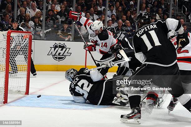 Adam Henrique of the New Jersey Devils scores a goal against Jonathan Quick of the Los Angeles Kings in Game Six of the 2012 Stanley Cup Final at...