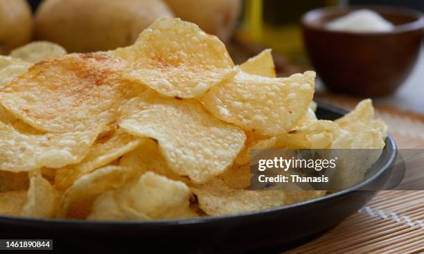 close up on potato chips - salty snack stock pictures, royalty-free photos & images