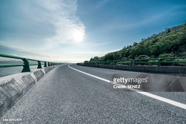 road background - crash barrier stock pictures, royalty-free photos & images