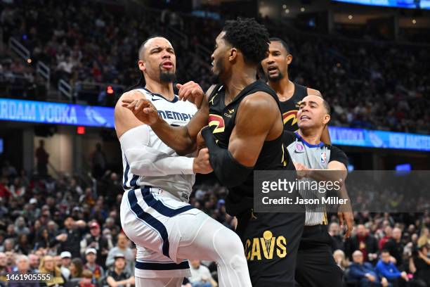 Dillon Brooks of the Memphis Grizzlies fights with Donovan Mitchell of the Cleveland Cavaliers during the third quarter at Rocket Mortgage Fieldhouse...
