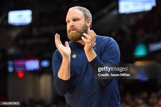 Head coach Taylor Jenkins of the Memphis Grizzlies applauds his players during the fourth quarter against the Cleveland Cavaliers at Rocket Mortgage...