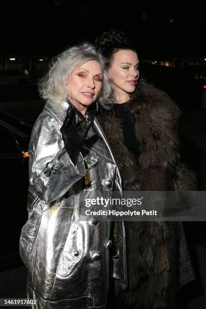 Debbie Harry, wearing a silver coat with black gloves, and Debi Mazar, wearing a brown faux fur jacket, are seen outside the Marc Jacobs Runway Show...