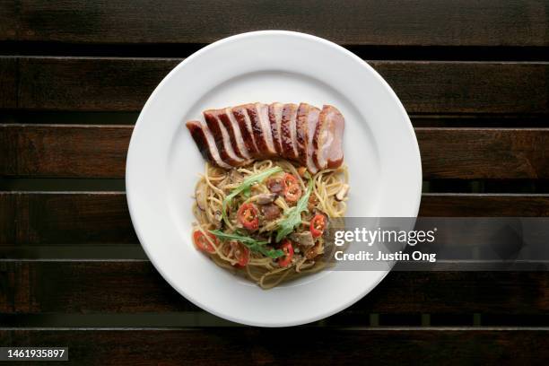 duck breast pasta with chili pepper - course meal stock pictures, royalty-free photos & images