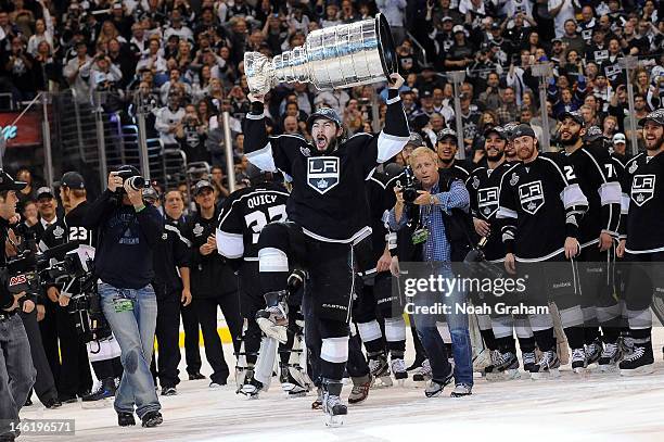 Drew Doughty of the Los Angeles Kings raises the Stanley Cup after defeating the New Jersey Devils after Game Six of the 2012 Stanley Cup Final at...