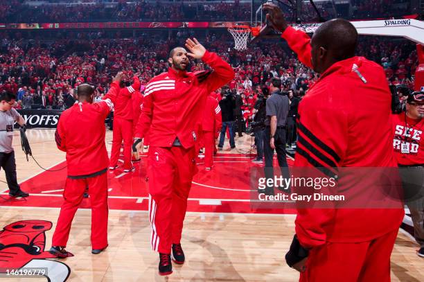 Carlos Boozer of the Chicago Bulls greets teammates before playing against the Philadelphia 76ers in Game Two of the Eastern Conference Quarterfinals...