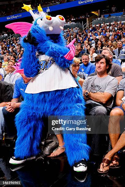 The Orlando Magic mascot performs in front of Golfer Bubba Watson in Game Four of the Eastern Conference Quarterfinals between the Indiana Pacers and...