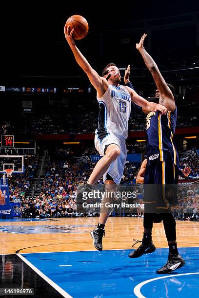 Hedo Turkoglu of the Orlando Magic goes to the basket against Roy Hibbert of the Indiana Pacers in Game Four of the Eastern Conference Quarterfinals...