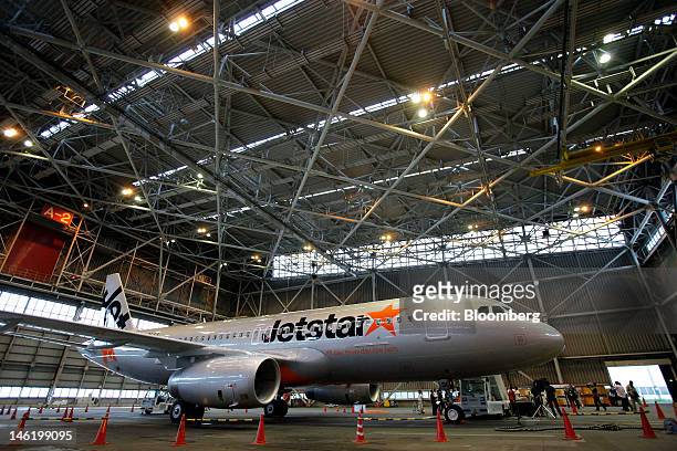 Jetstar Japan Co.'s Airbus SAS A320 aircraft sits in a hangar during a media preview at Narita Airport in Narita City, Chiba Prefecture, Japan, on...