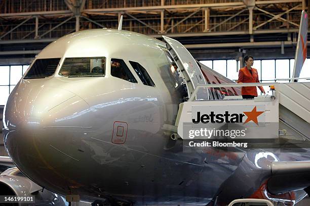 Jetstar Japan Co.'s first Airbus SAS A320 aircraft sits in a hangar during a media preview at Narita Airport in Narita City, Chiba Prefecture, Japan,...