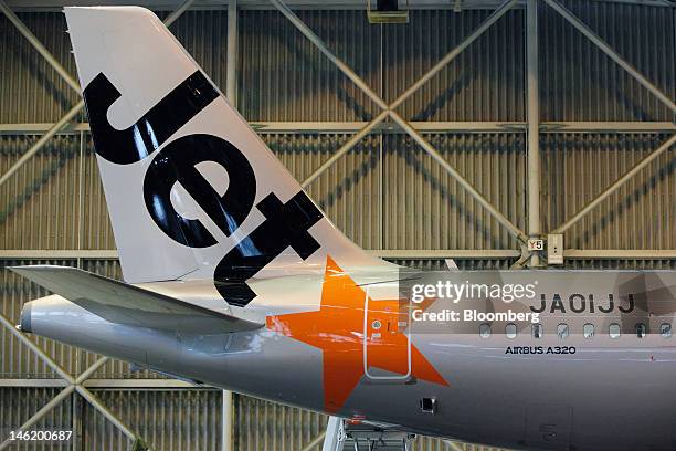 Jetstar Japan Co.'s Airbus SAS A320 aircraft sits in a hangar during a media preview at Narita Airport in Narita City, Chiba Prefecture, Japan, on...