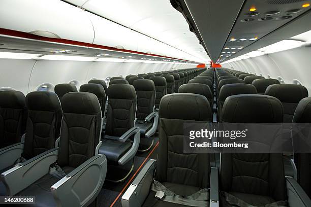 The interior of the economy class cabin of Jetstar Japan Co.'s first Airbus SAS A320 aircraft is seen during a media preview at Narita Airport in...