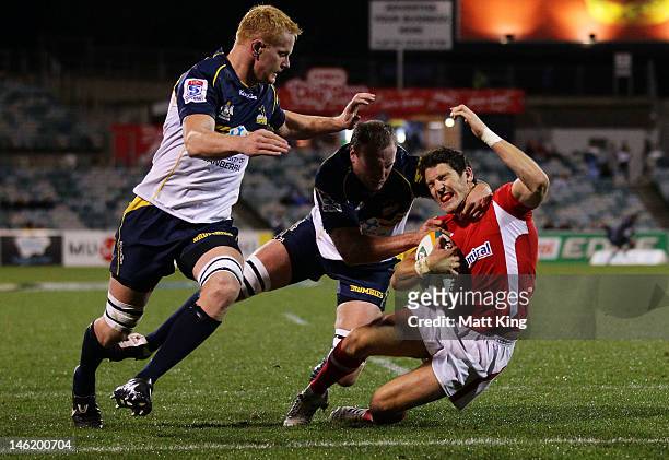James Hook of Wales crosses the line to score a try during the tour match between the ACT Brumbies and Wales at Canberra Stadium on June 12, 2012 in...