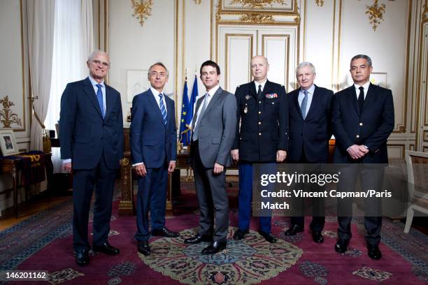 Minister of Interior for France Manuel Valls is photographed with his aides Bernard Boucault, Claude Baland, General Jacques Mignaux, Jean Daubigny,...